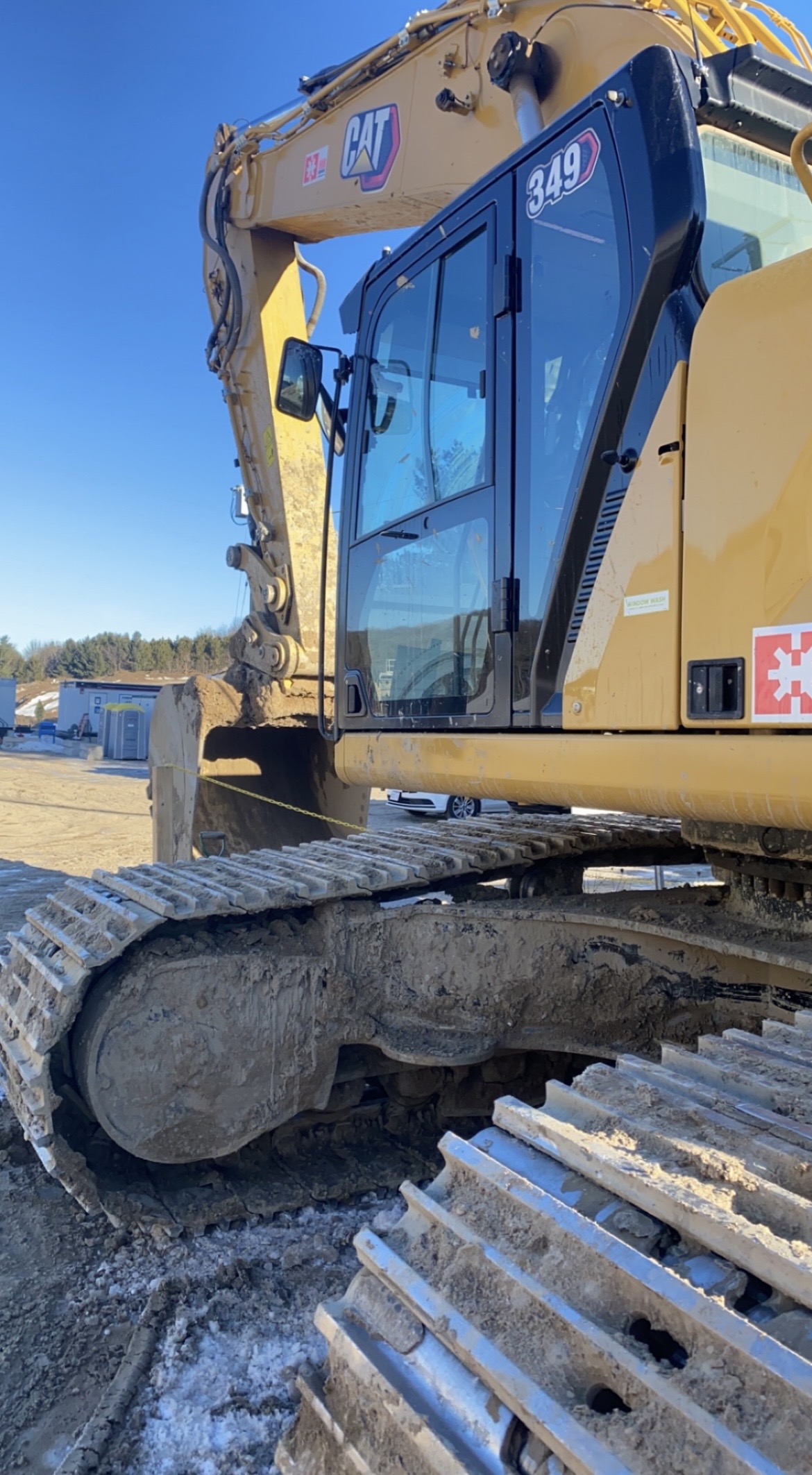 John Deere excavator on a civil construction site beside the water
